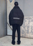 メスノウン(MASSNOUN) SL LOGO REFLECTIVE OVERSIZED PADDING JUMPER MFEPD001-BK