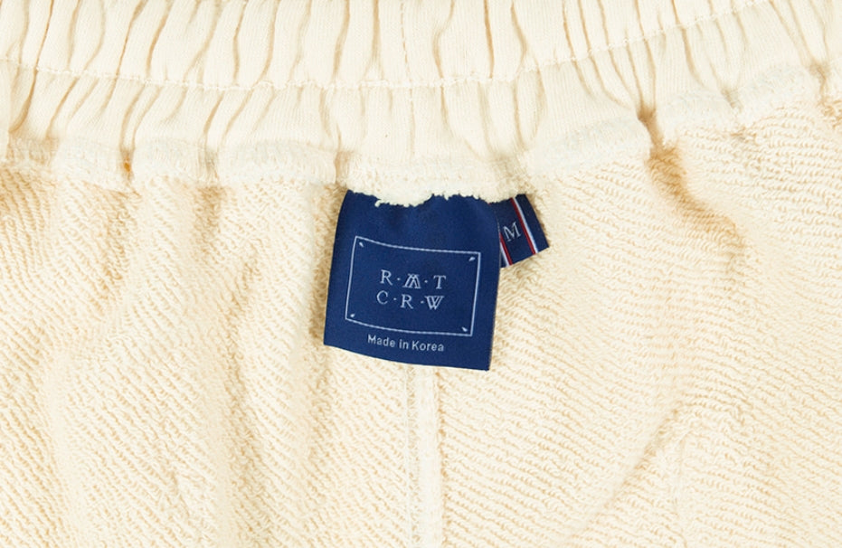 ロマンティッククラウン(ROMANTIC CROWN) COLOR BLOCK LOGO SWEAT PANTS_OATMEAL