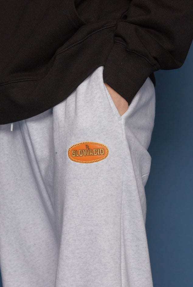 スローアシッド(SLOW ACID) Leather Patch Sweatpants (PALE MELANGE)