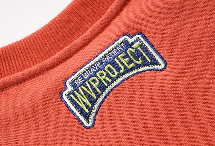 ダブルユーブイプロジェクト(WV PROJECT) Baker Emblem Sweatshirt Dark Orange JJMT7409