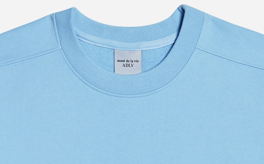 アクメドラビ(acme' de la vie)  TWO COLORS EMBROIDERY SWEAT SHIRT SKY BLUE