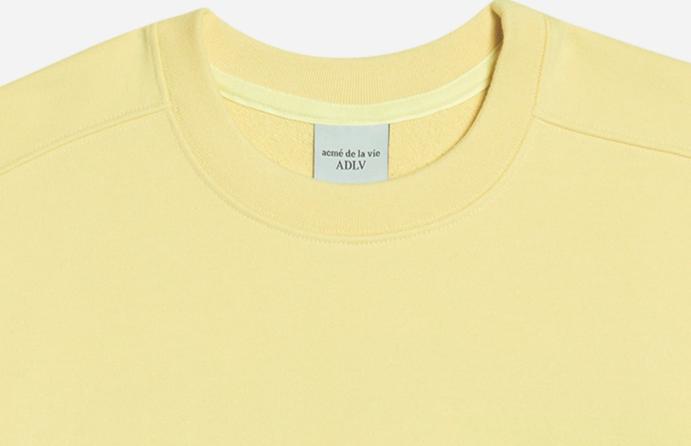 アクメドラビ(acme' de la vie) TWO COLORS EMBROIDERY SWEAT SHIRT LIGHT YELLOW