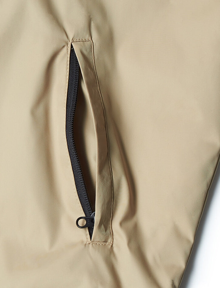 NOMANUAL(ノーマニュアル)  FD WINDBREAKER JACKET - BEIGE