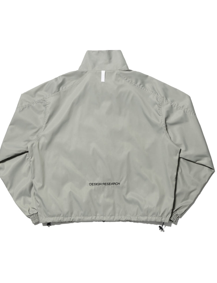 NOMANUAL(ノーマニュアル)  FD WINDBREAKER JACKET - WARM GRAY