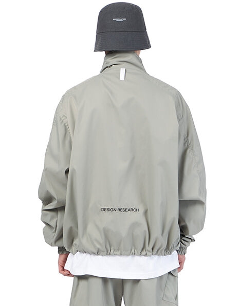 NOMANUAL(ノーマニュアル)  FD WINDBREAKER JACKET - WARM GRAY