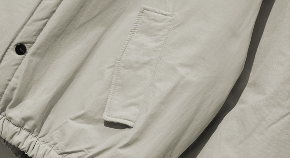ダブルユーブイプロジェクト(WV PROJECT) Woven Hooded Coach Jacket Beige JIOT7540