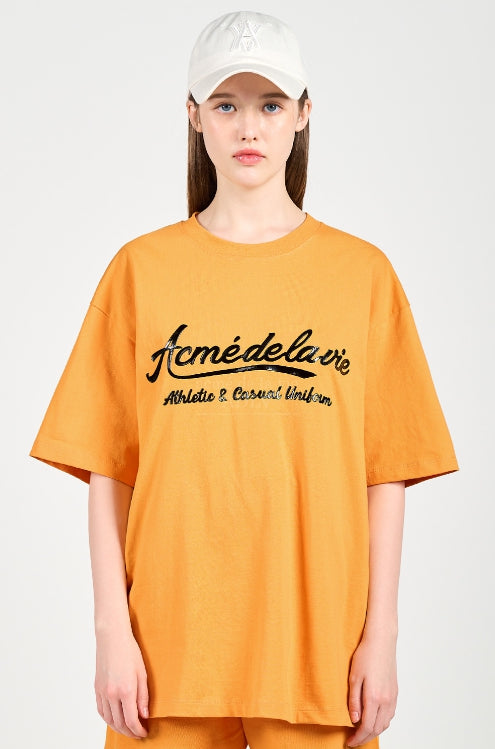 アクメドラビ(acme' de la vie) GEL PRINTING LOGO SHORT SLEEVE T-SHIRT ORANGE