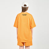アクメドラビ(acme' de la vie) GEL PRINTING LOGO SHORT SLEEVE T-SHIRT ORANGE