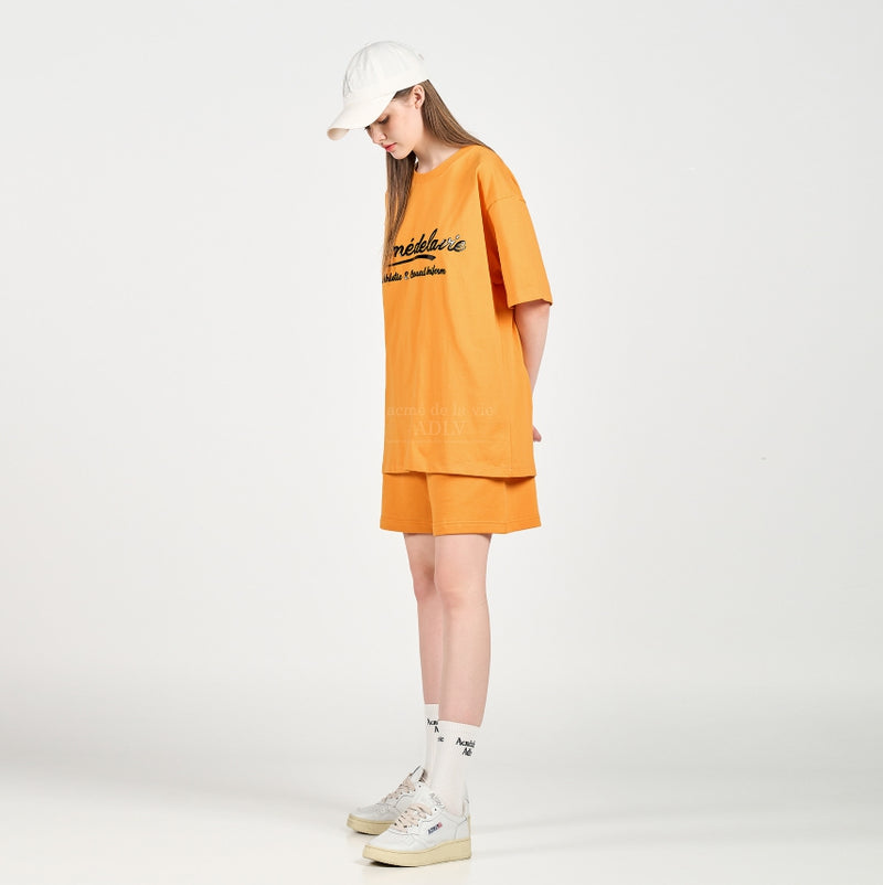 アクメドラビ(acme' de la vie) GEL PRINTING LOGO SHORT SLEEVE T-SHIRT ORANGE
