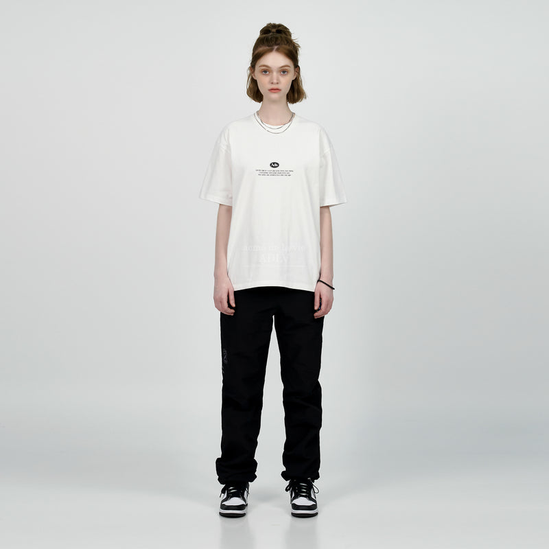 アクメドラビ(acme' de la vie) BACK SPREAD SLOGAN SHORT SLEEVE T-SHIRT BLUE