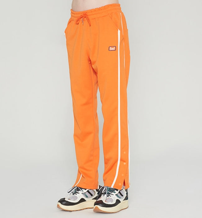 ベドインベド(BADINBAD)SIDE BUTTON PANTS_ORANGE
