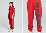 アクメドラビ(acme' de la vie) BIG LOGO EMBO PANTS FOR WOMEN LIGHT RED