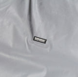 NOMANUAL(ノーマニュアル) LOGO PATCHED WARM-UP TOP - REFLECTIVE