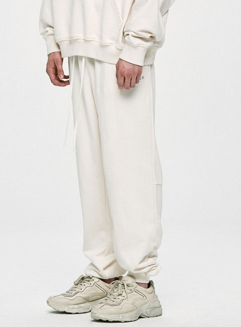 ディープリーク(DPRIQUE)  LOGO JOGGER PANTS - IVORY
