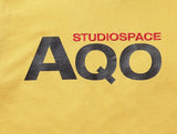 AQO_studiospace(アコスタジオスペース)  AQO SIGNATURE T SHIRT YELLOW