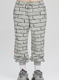 ベドインベド(BADINBAD)  BRICK GRAFFITI SWEATPANTS_GREY