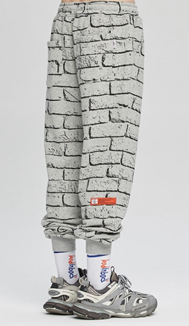 ベドインベド(BADINBAD)  BRICK GRAFFITI SWEATPANTS_GREY