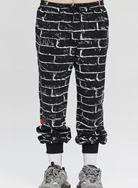 ベドインベド(BADINBAD)  BRICK GRAFFITI SWEATPANTS_BLACK