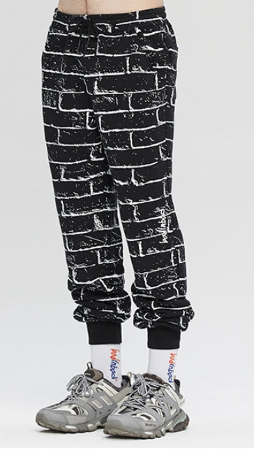 ベドインベド(BADINBAD)  BRICK GRAFFITI SWEATPANTS_BLACK