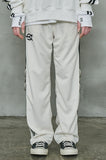 オーワイ(OY)  	WIDE TAPE RING TRACK PANTS-CREAM