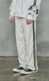 オーワイ(OY)  	WIDE TAPE RING TRACK PANTS-CREAM