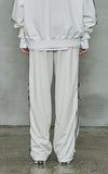 オーワイ(OY)  	WIDE TAPE RING TRACK PANTS-CREAM