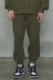 オーワイ(OY)  	UNBALANCE JOGGER PANTS-KHAKI