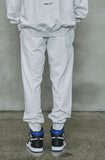 オーワイ(OY)  	UNBALANCE JOGGER PANTS-LIGHT GREY