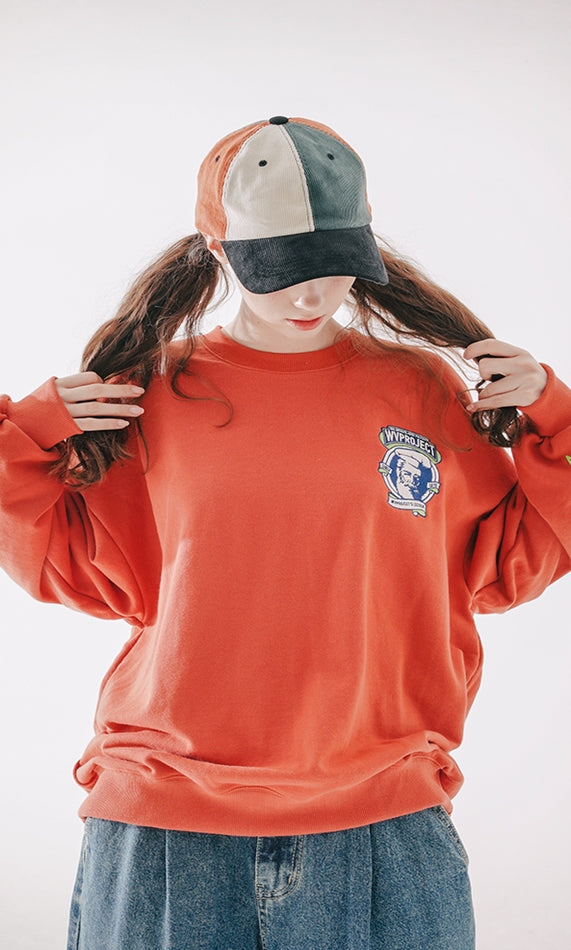 ダブルユーブイプロジェクト(WV PROJECT) Baker Emblem Sweatshirt Dark Orange JJMT7409