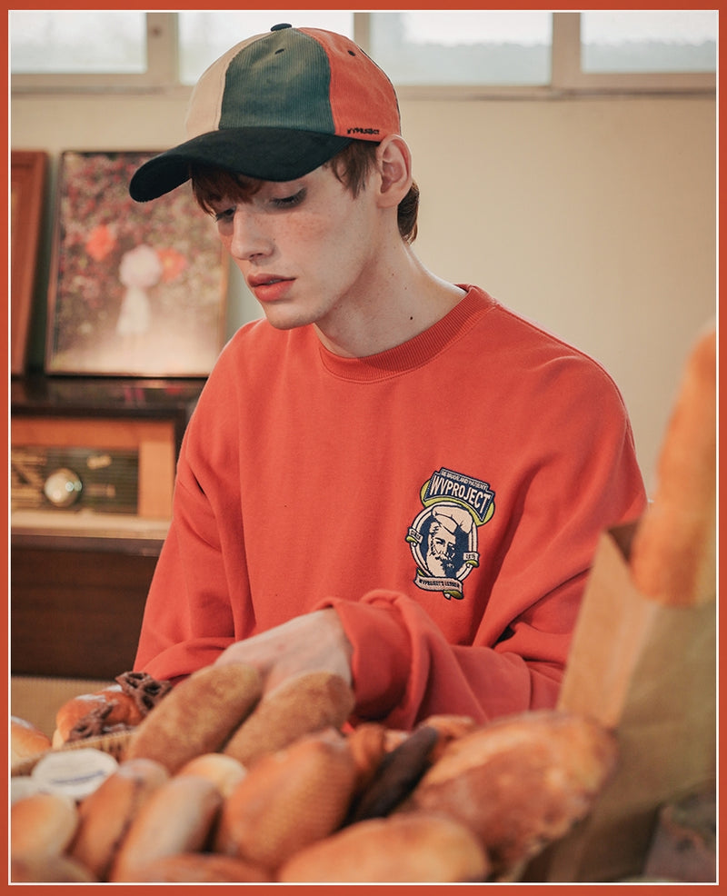 ダブルユーブイプロジェクト(WV PROJECT) Baker Emblem Sweatshirt Dark Orange JJMT7409