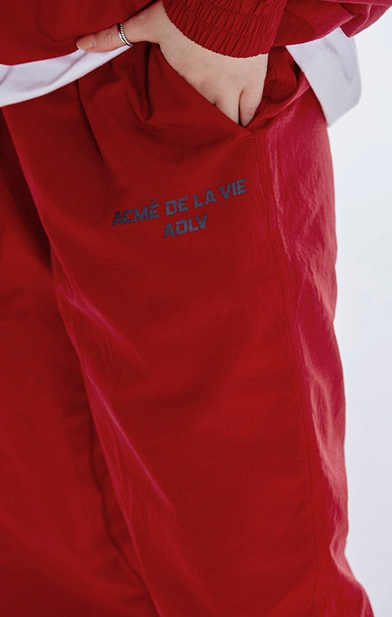 アクメドラビ(acme' de la vie)   ADLV SPORTY LOGO WOVEN PANTS RED