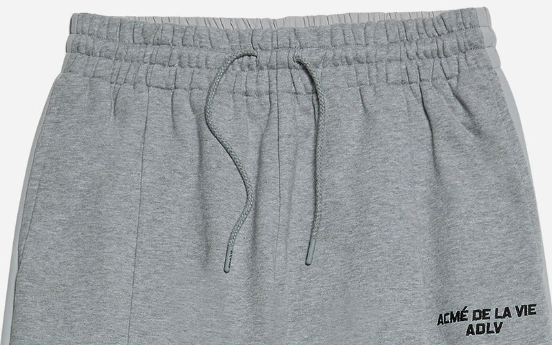 アクメドラビ(acme' de la vie)   MULTICUT TRAINING PANTS MELANGE