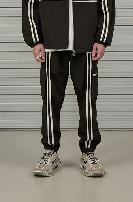 オーワイ(OY)  LINE TAPE CARGO TRACK PANTS-BLACK