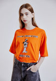 ORDINARY PEOPLE(オーディナリーピープル) [ORDINARYPEOPLE X DISNEY] DIRECTING GOOFY ORANGE T-SHIRTS