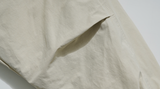 ダブルユーブイプロジェクト(WV PROJECT) Woven Hooded Coach Jacket Beige JIOT7540