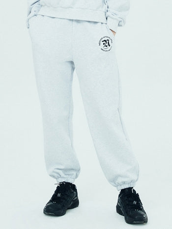 NCOVER（エンカバー）ROMAN TYPO LOGO TRAINING PANTS-WHITE MELANGE