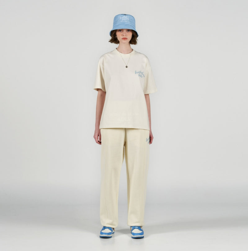 アクメドラビ(acme' de la vie) SCRIPT LOGO EMBROIDERY LONG PANTS IVORY