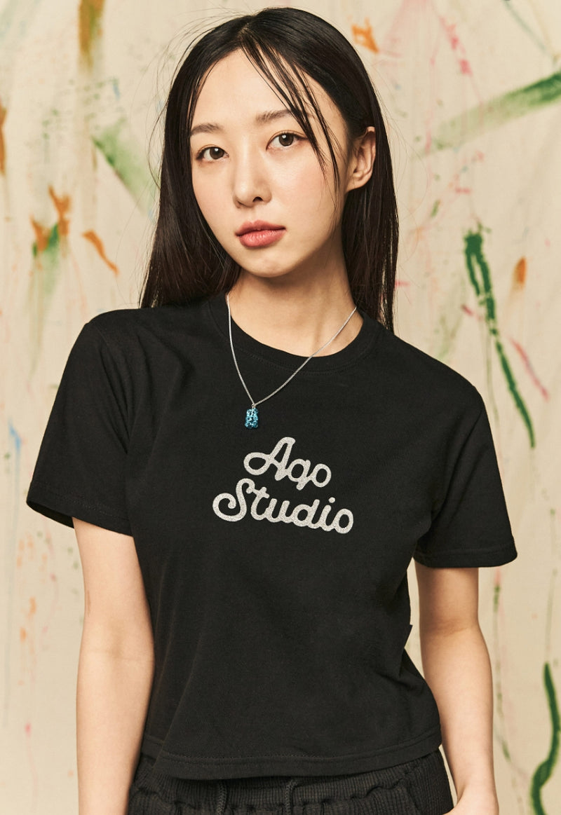 AQO_studiospace(アコスタジオスペース)  AQO A-LOGO GLITER CROP TEE BLACK