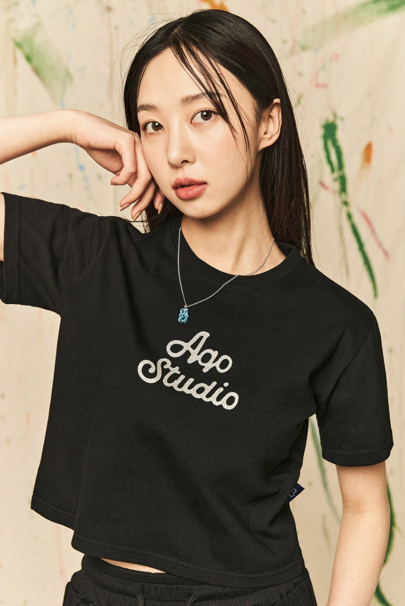 AQO_studiospace(アコスタジオスペース)  AQO A-LOGO GLITER CROP TEE BLACK