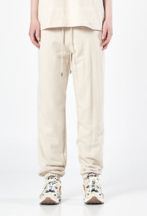 アクメドラビ(acme' de la vie) A LOGO EMBLEM PATCH TRAINING PANTS BEIGE