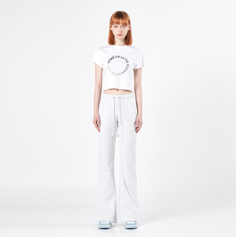 アクメドラビ(acme' de la vie) CIRCLE LOGO ARTWORK BOOTS CUT TRAINING PANTS MELANGE