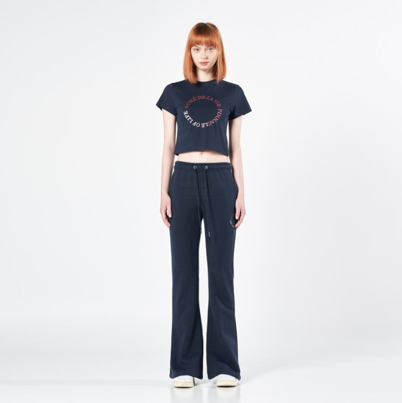 アクメドラビ(acme' de la vie) CIRCLE LOGO ARTWORK BOOTS CUT TRAINING PANTS NAVY