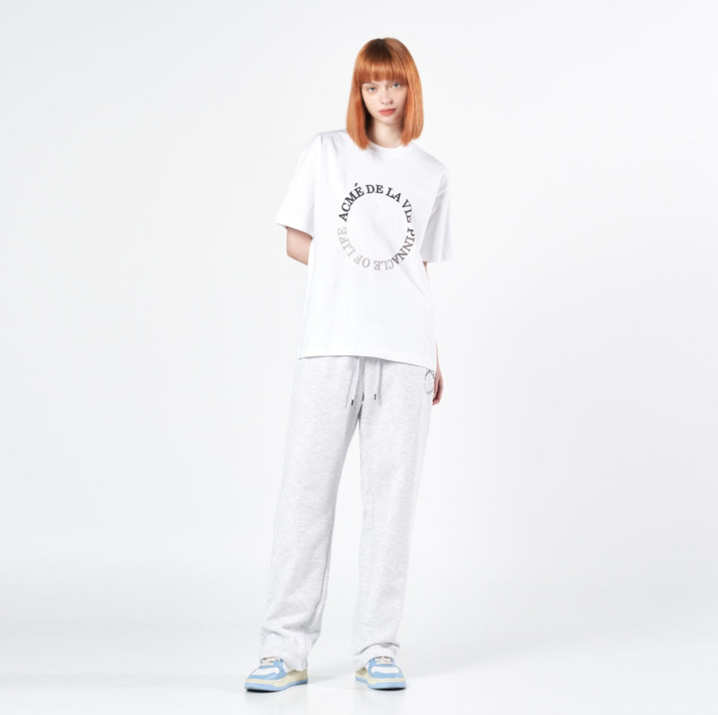 アクメドラビ(acme' de la vie)  CIRCLE LOGO ARTWORK WIDE TRAINING PANTS MELANGE