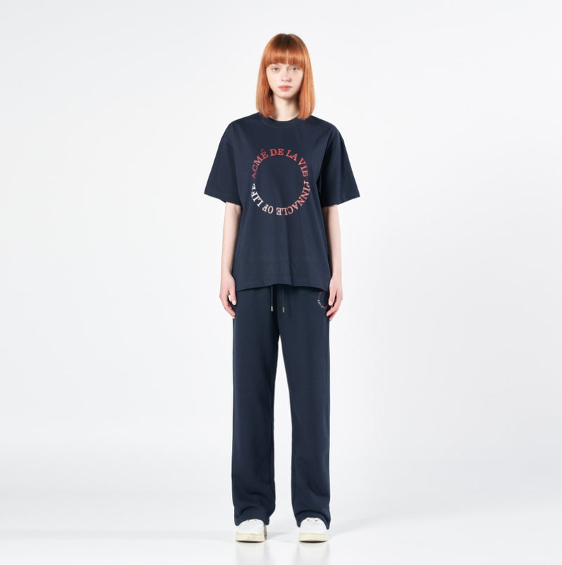 アクメドラビ(acme' de la vie) CIRCLE LOGO ARTWORK WIDE TRAINING PANTS NAVY
