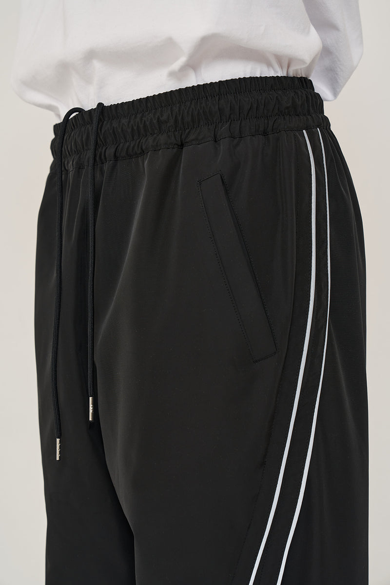 オーワイ(OY)   CURVE LINE LOGO TRACK PANTS-BLACK