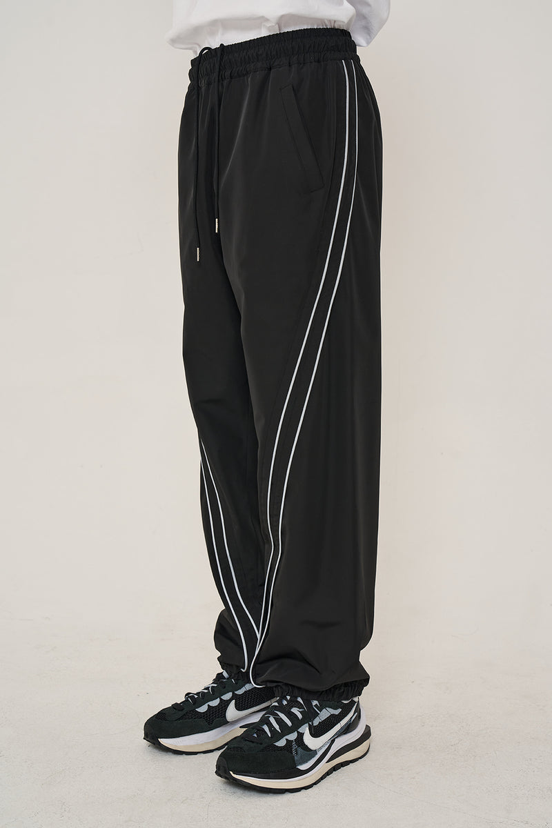 オーワイ(OY)   CURVE LINE LOGO TRACK PANTS-BLACK