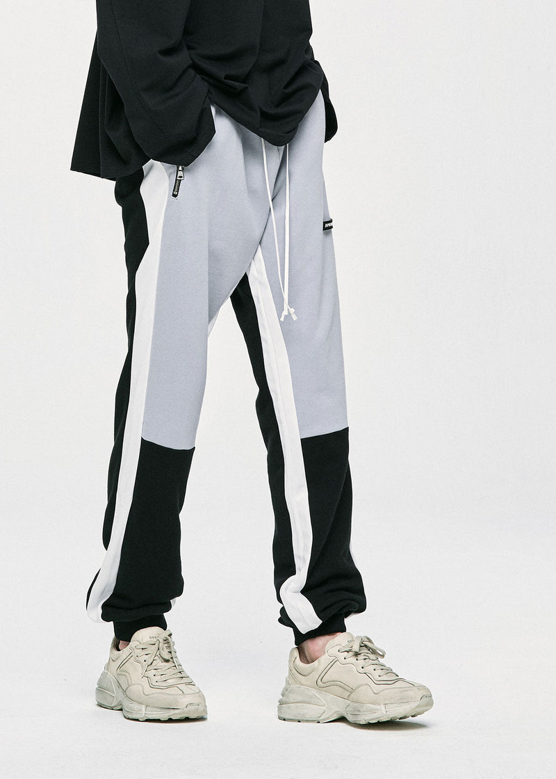 ディープリーク(DPRIQUE)  PANEL ZIPPER TRACK PANTS - LIGHT GREY/BLACK